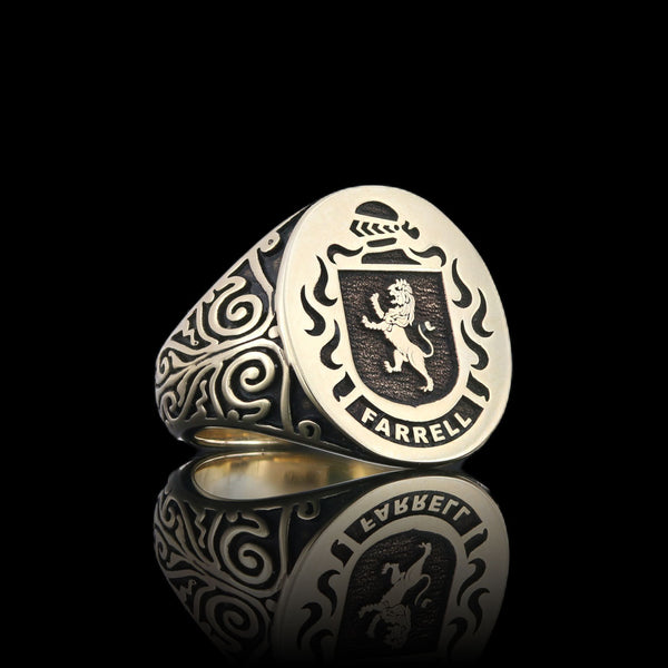 Farrell family gold signet ring with a lion emblem and intricate side patterns, reflecting heritage and artistry.