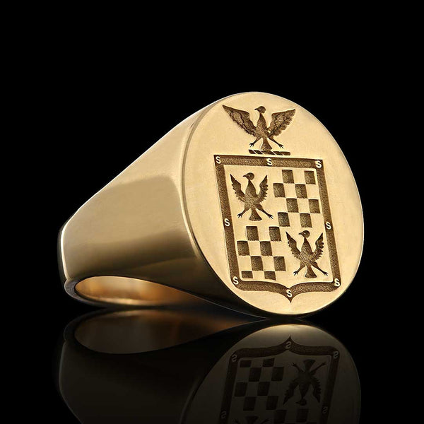 Elegant gold signet ring featuring an intricately engraved eagle above traditional Italian coat of arms.