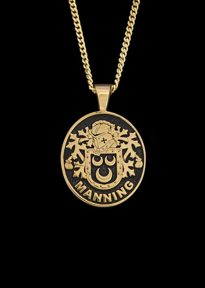 Gold Manning pendant necklace with engraved family crest and last name.