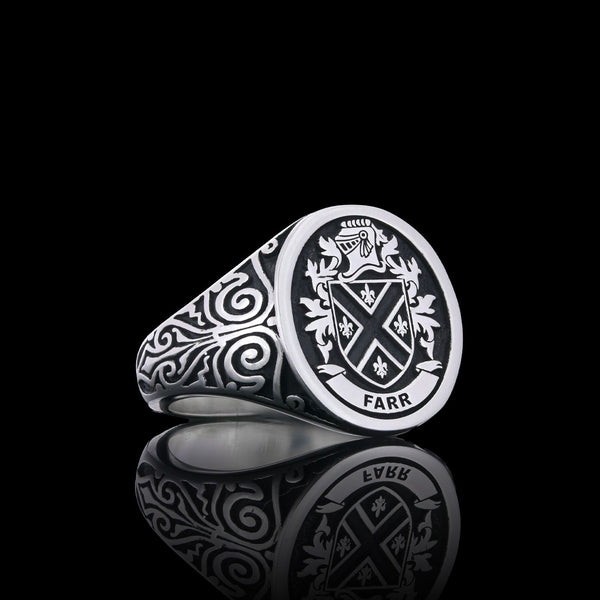 Farr family silver signet ring with a checkered crest, displayed with a regal and polished finish.