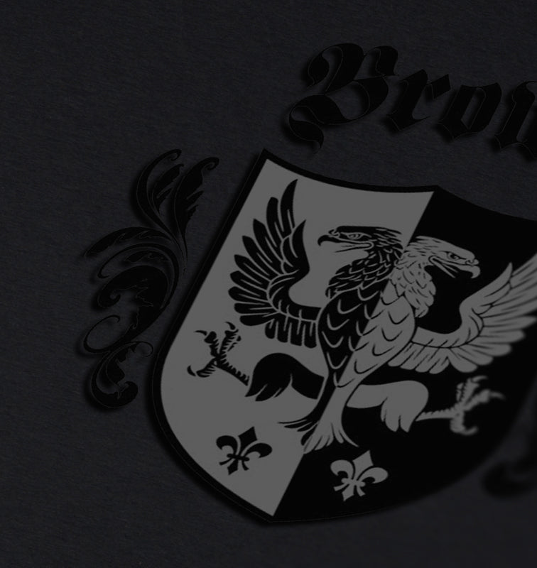 Brown family crest on a dark gray background, featuring a black and white eagle design on a divided shield.