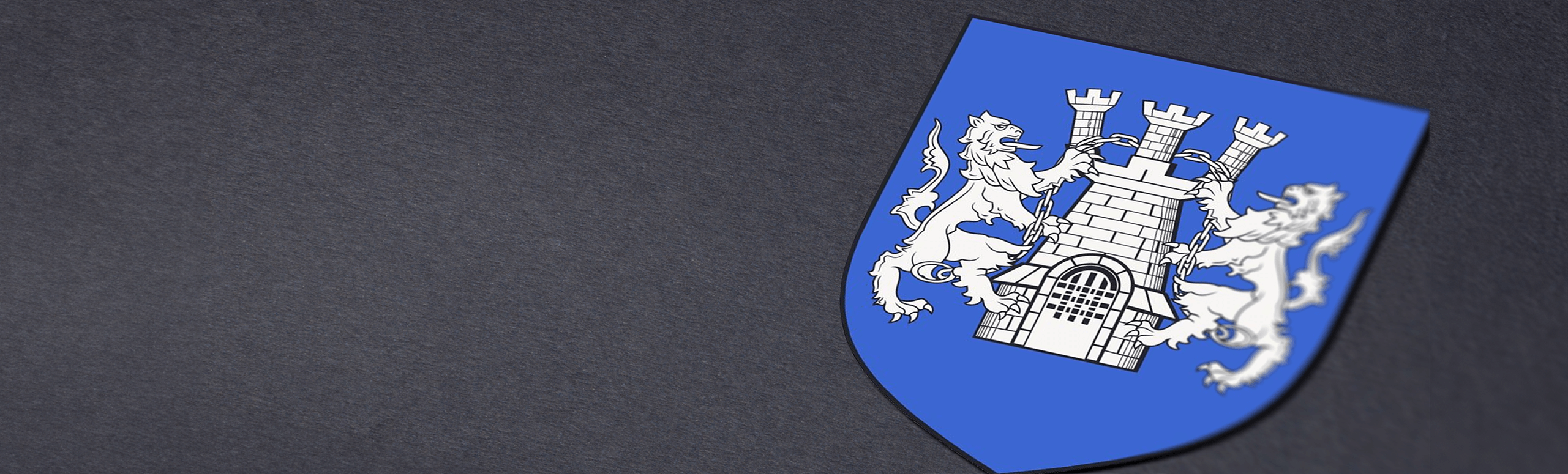 Kelly family crest on a dark gray background, showing a red lion and crescent moon on a blue shield.